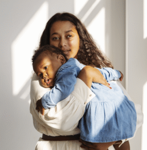 black mother taking car her child